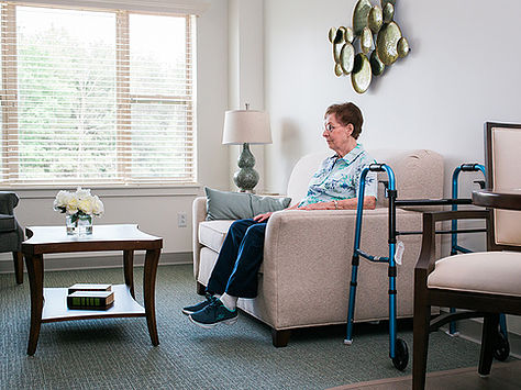 Resident sitting down watching TV