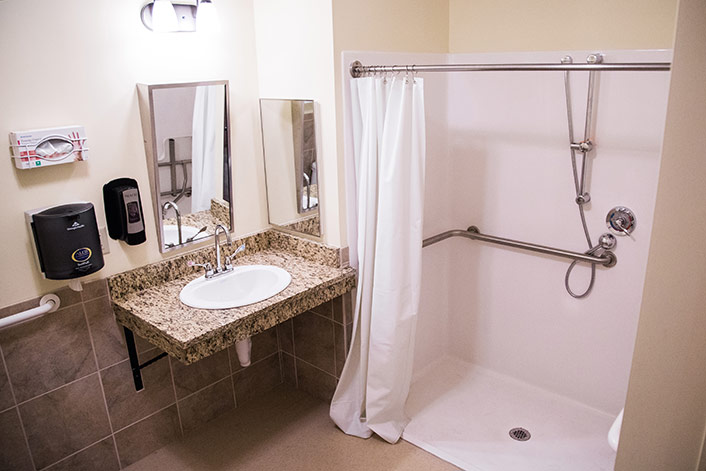 Rehab Shower bathroom with sink and shower