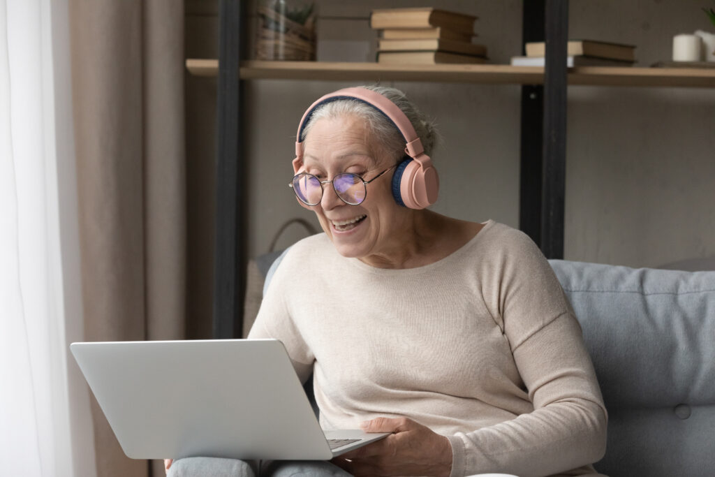 Older woman lead conversation through video conference use laptop